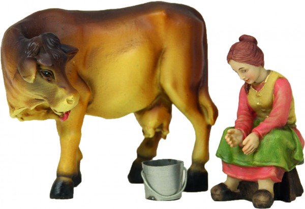 Bäuerin mit Kuh beim Melken Bäuerin mit Kuh beim Melken